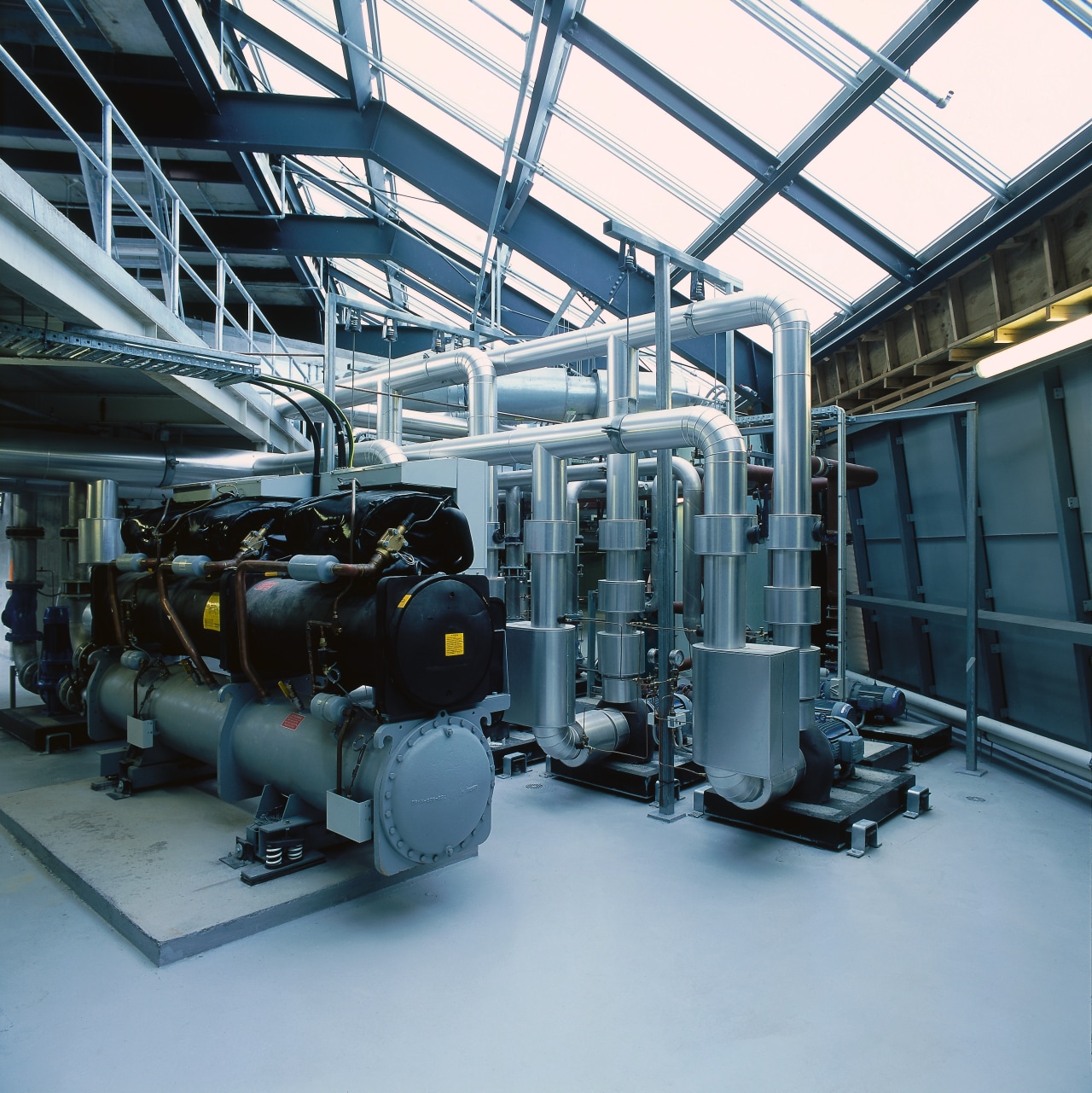 View of the plant room at the engineering, factory, industry, machine, manufacturing, black, teal, gray