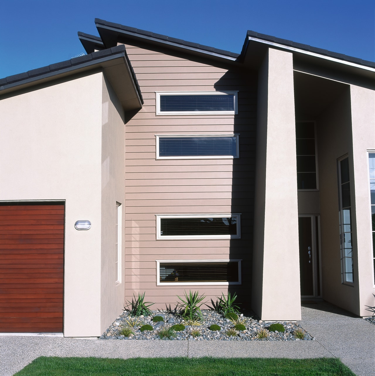 view of the exterior of this jalcon show architecture, building, commercial building, elevation, estate, facade, home, house, property, real estate, residential area, siding, window, white