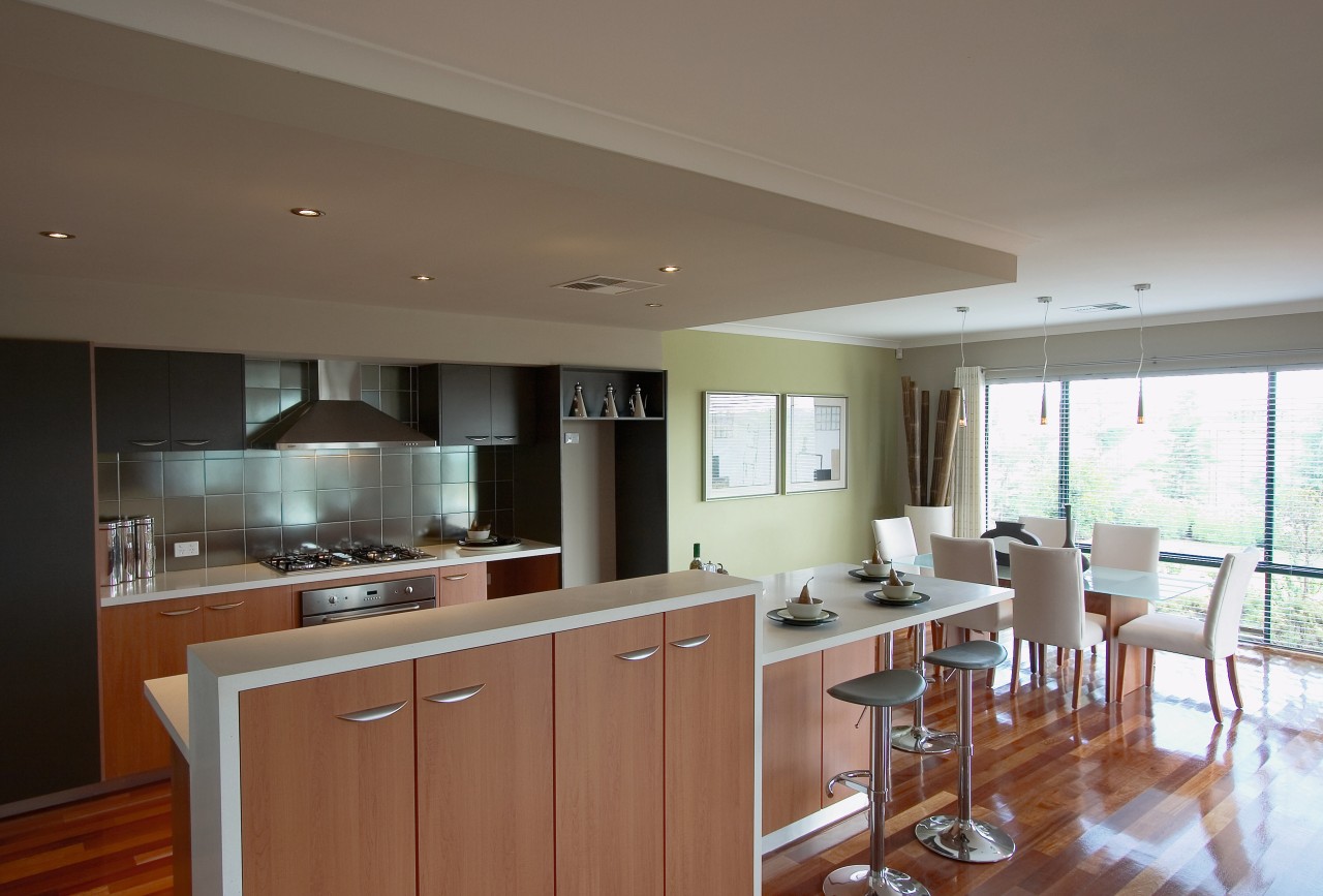 view of this kitchen that features polished timber cabinetry, countertop, cuisine classique, floor, flooring, home, interior design, kitchen, property, real estate, room, window, gray, brown