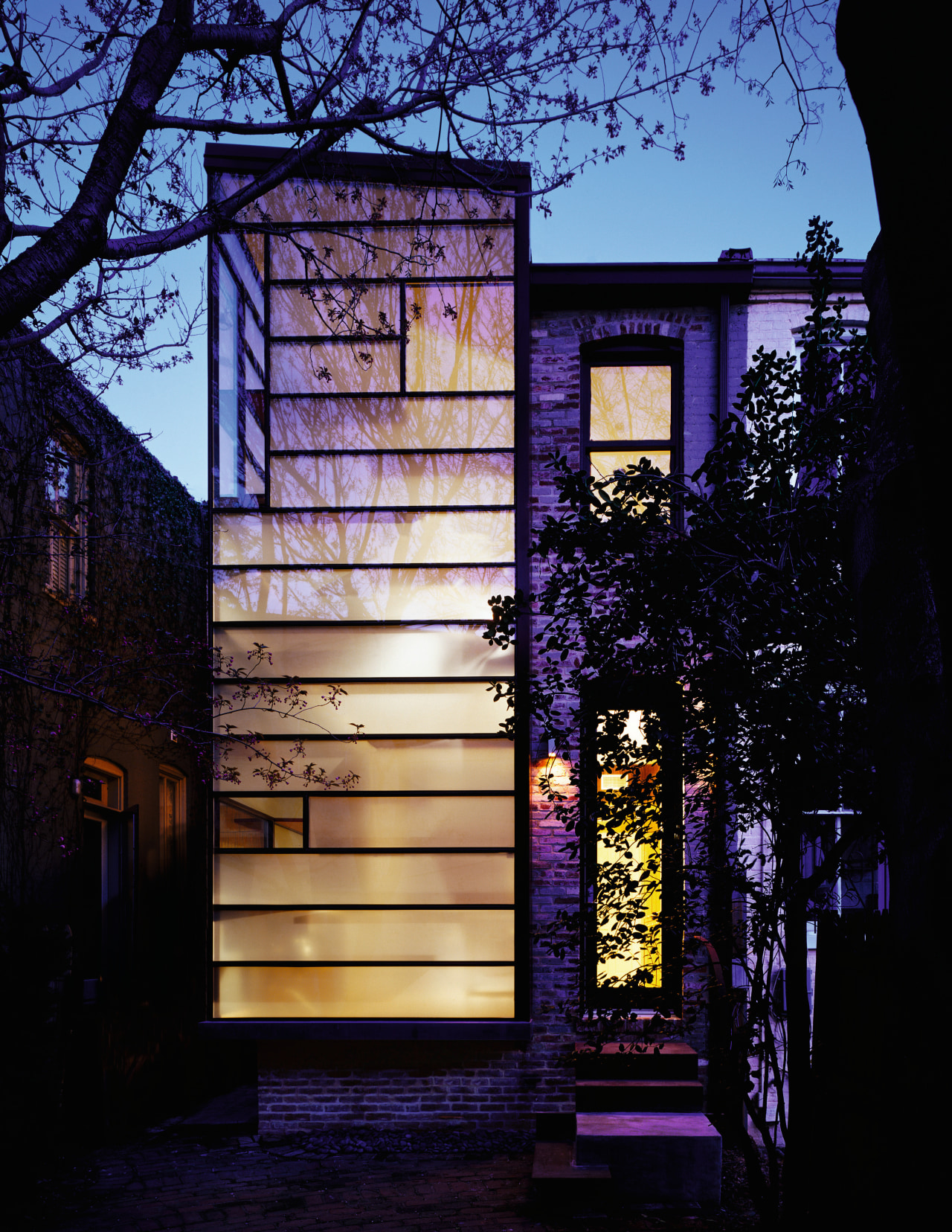 Architect David Jameson modern insertion into this row architecture, building, facade, glass, home, house, landscape lighting, light, lighting, purple, reflection, window, black