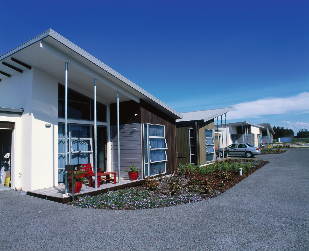 An exterior view of the retirement village. cottage, facade, home, house, property, real estate, residential area, sky, blue, gray