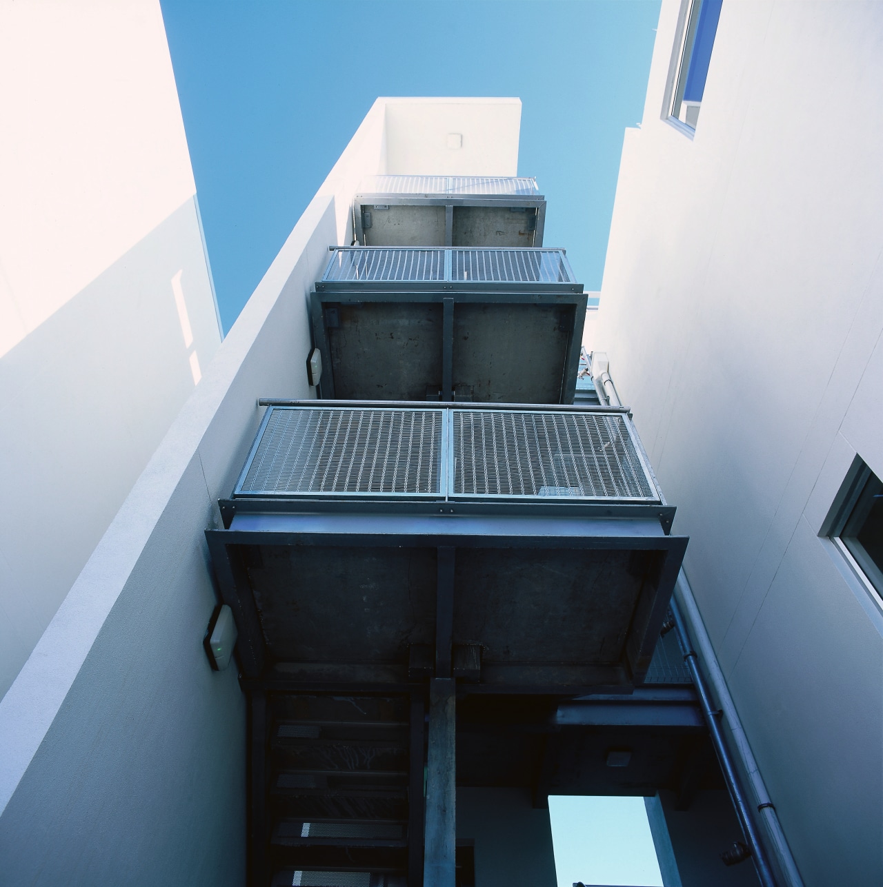 An exterior view of the steel used on architecture, building, daylighting, glass, house, stairs, white, black, teal