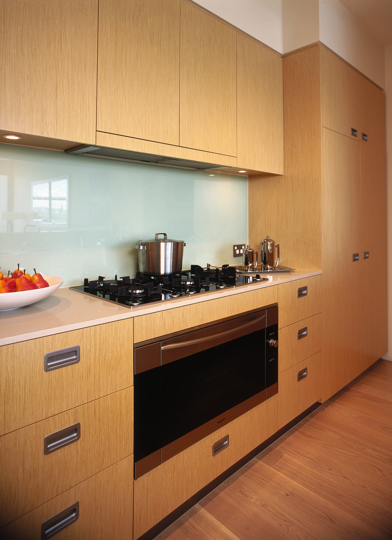 A view of a kitchen, wooden cabinetry and cabinetry, countertop, cuisine classique, interior design, kitchen, room, orange, brown