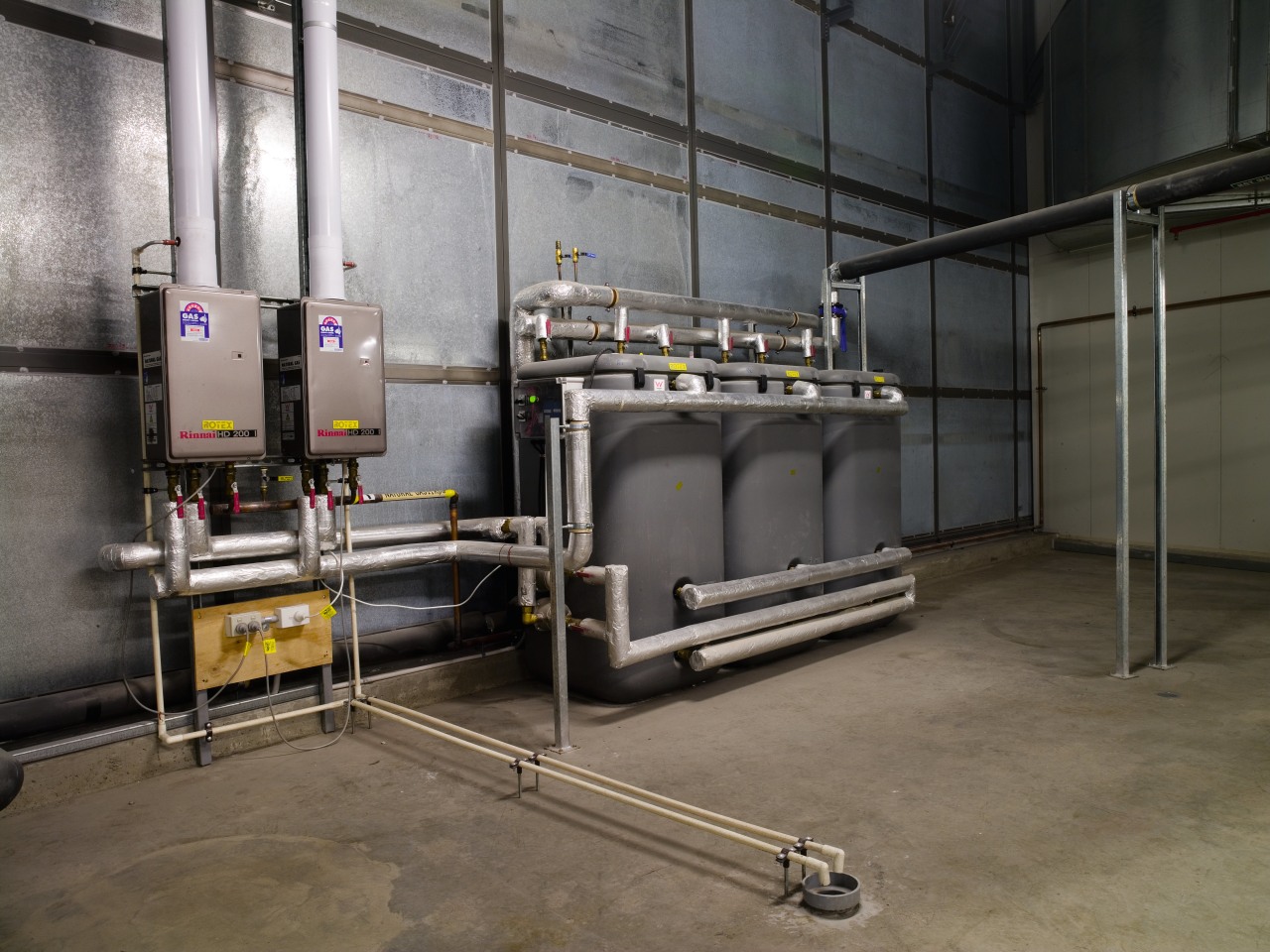 A view of the plumbing system. factory, industry, machine, manufacturing, gray, black