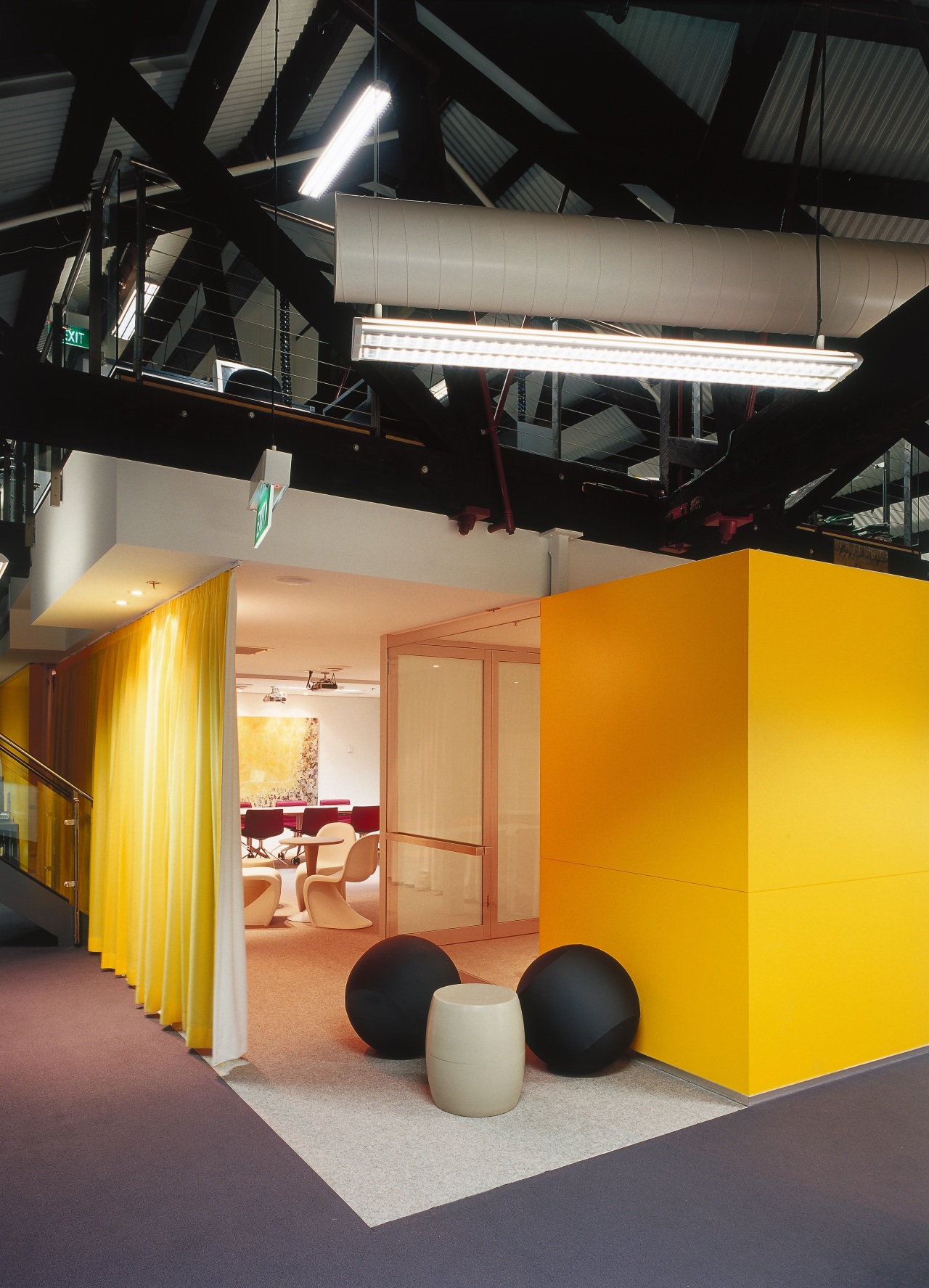 A view of a communal area. architecture, ceiling, interior design, product design, black, orange