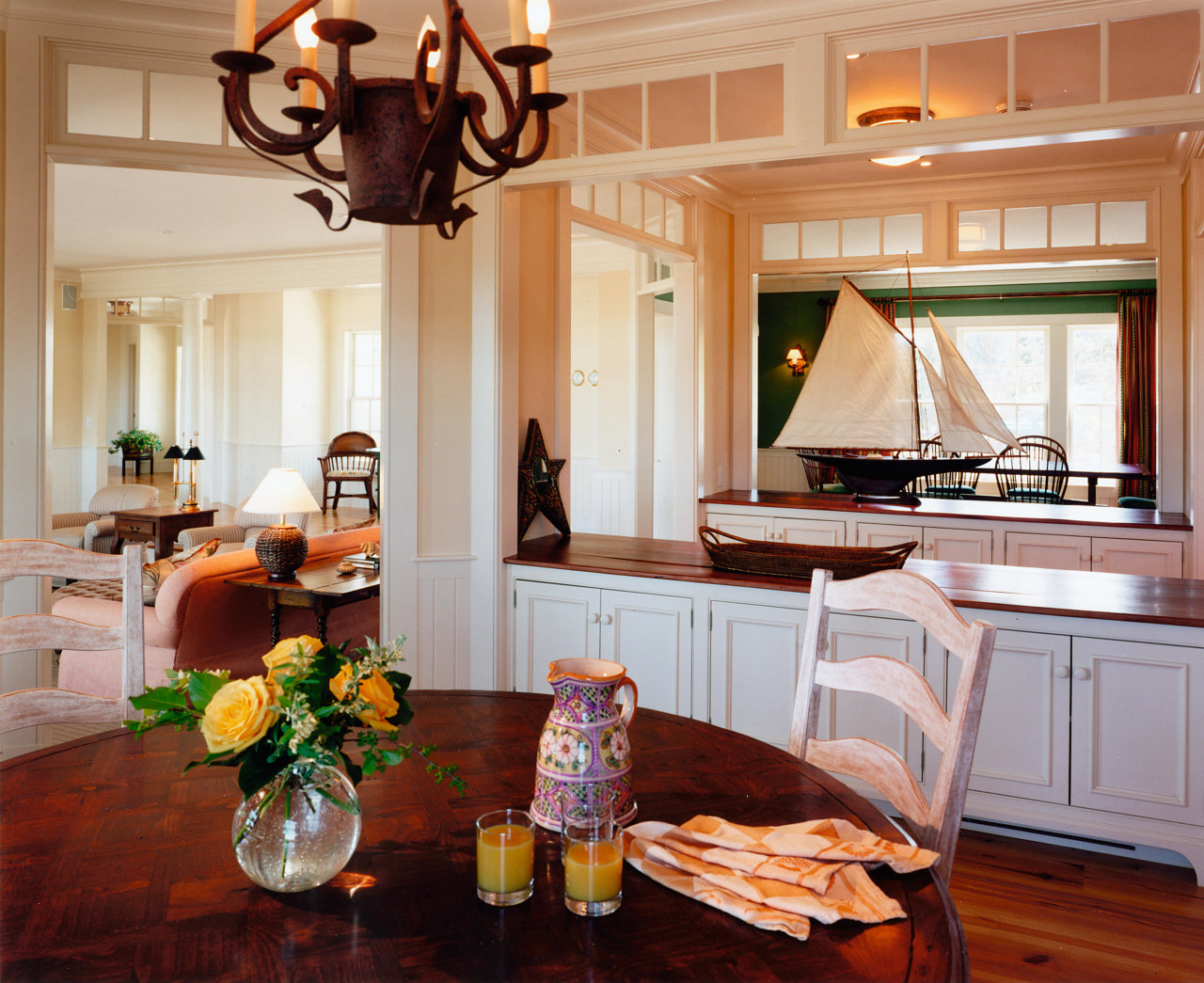 Dining and kitchen areas with timber table, cabinetry countertop, cuisine classique, dining room, home, interior design, kitchen, living room, room, gray, orange