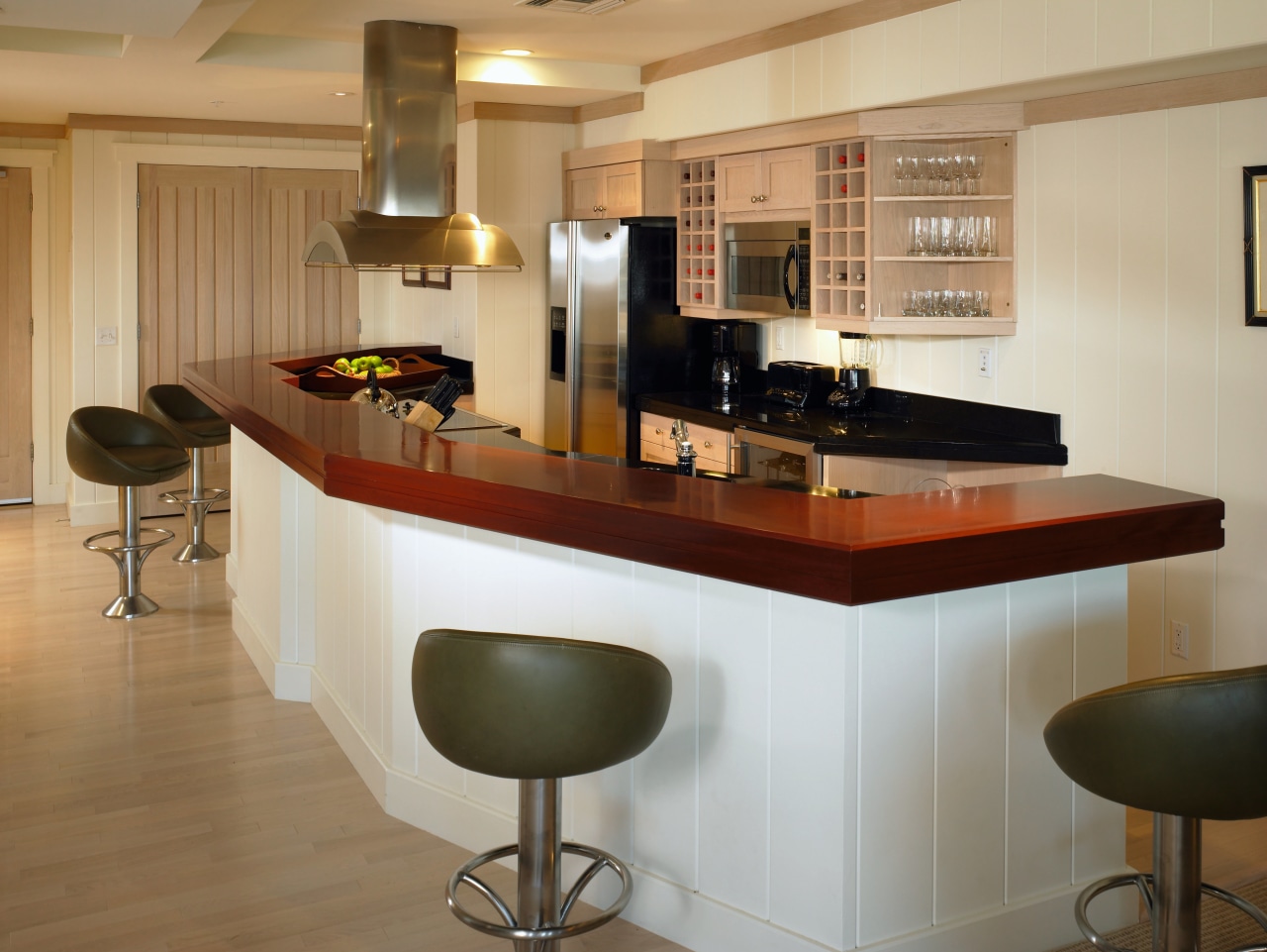 Kitchen with mahogony island countertop, black granite countertop, cabinetry, countertop, cuisine classique, floor, flooring, furniture, interior design, kitchen, room, brown, orange