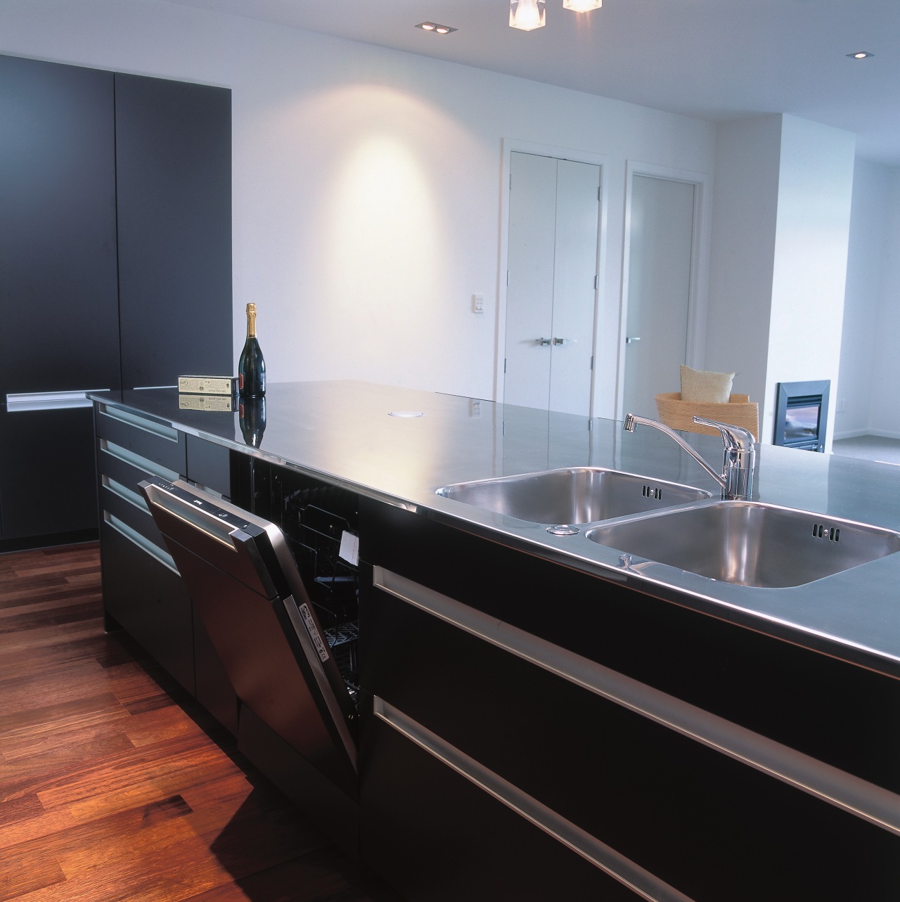 Kitchen with dark coloured cabinetry, stainless steel benchtop cabinetry, countertop, floor, glass, interior design, kitchen, sink, gray, black