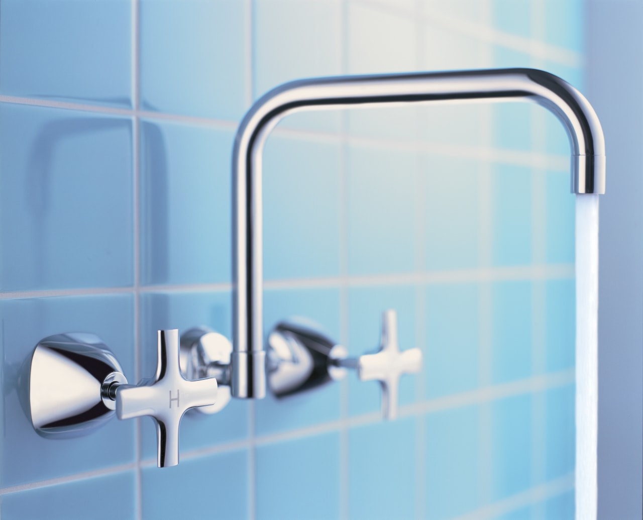 Tapware set into wall with blue tiles behind. blue, line, plumbing fixture, product, product design, tap, teal, white