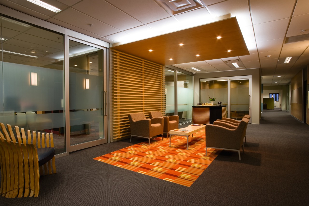 A view of the reception area in an ceiling, conference hall, floor, flooring, interior design, lobby, office, brown