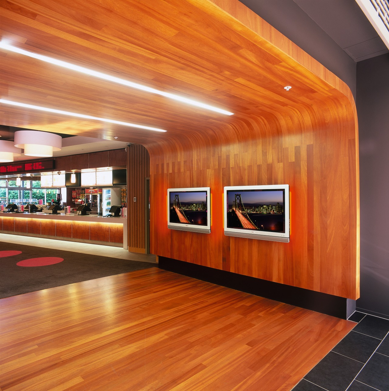 Two plasma tv screens mounted on timber wall architecture, ceiling, floor, flooring, hardwood, interior design, lobby, wall, wood, wood flooring, brown, orange