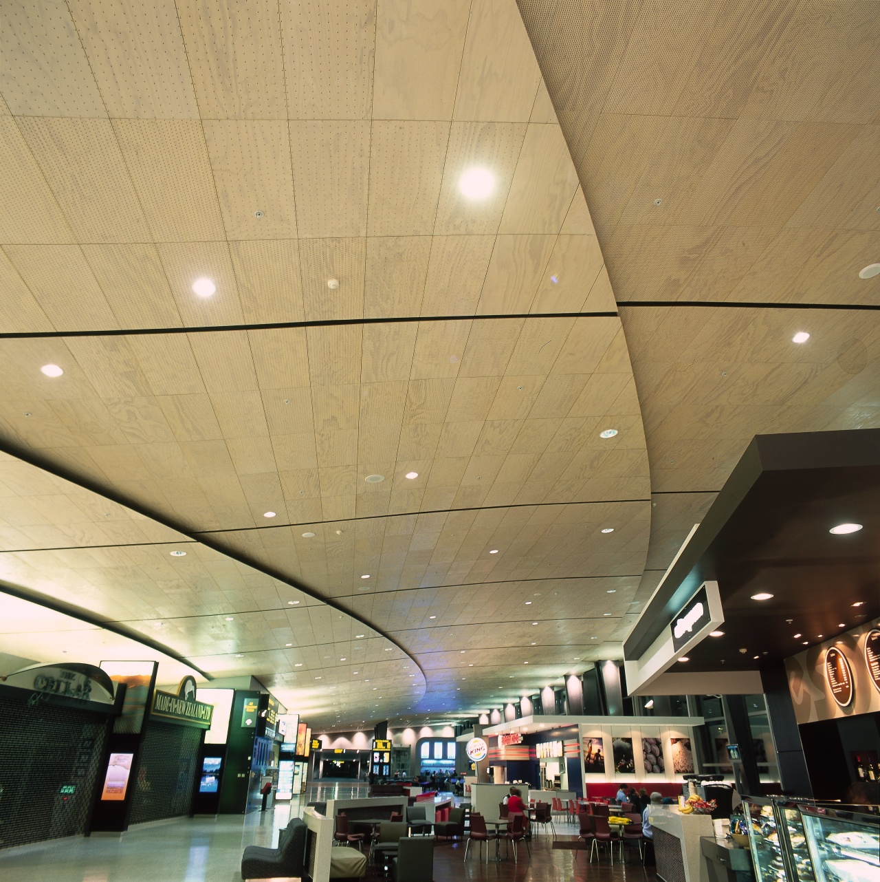 View of various retail and eatery premises at airport terminal, architecture, ceiling, daylighting, interior design, lobby, orange, brown