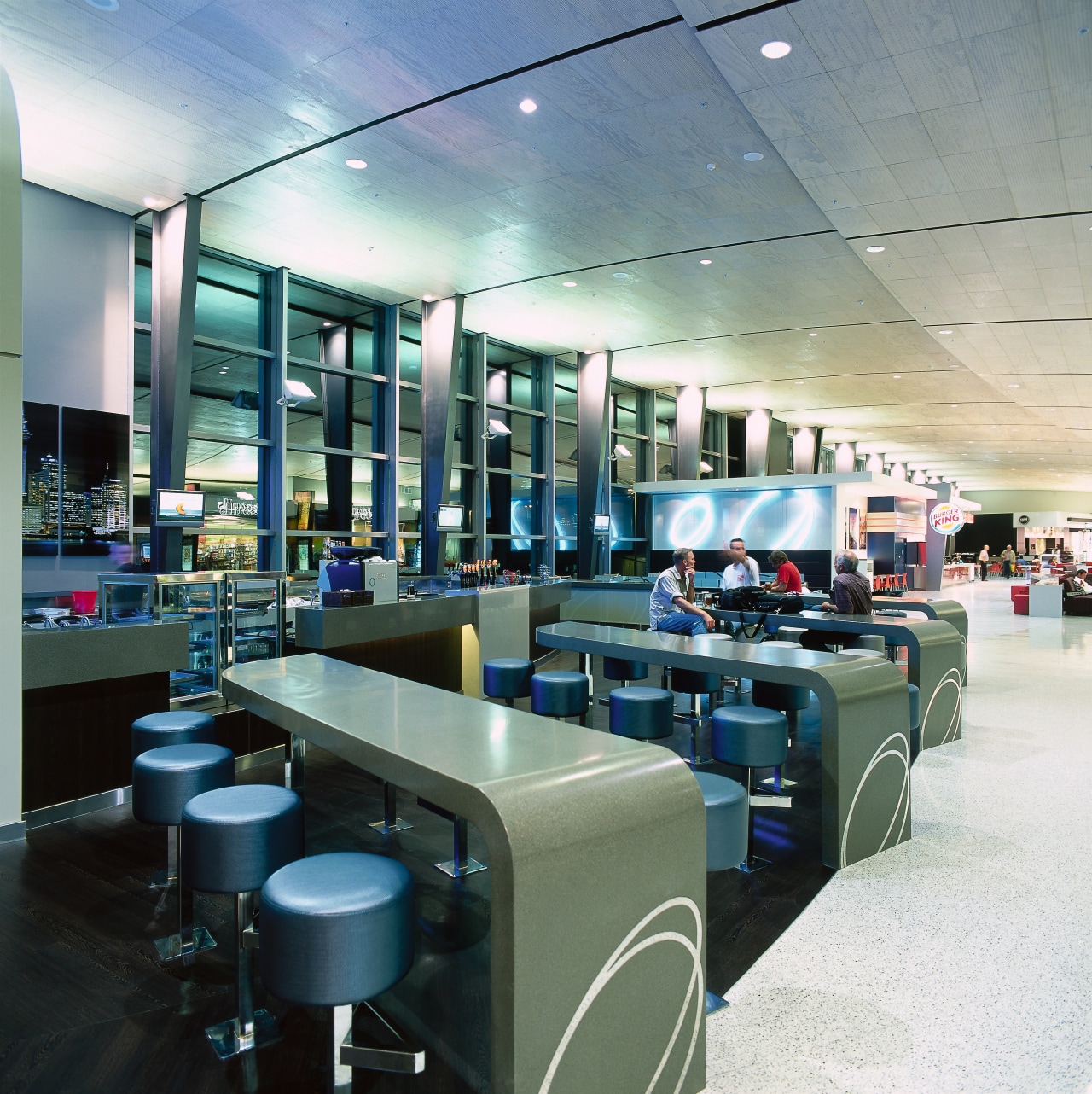 View of bar area in food court with interior design, gray