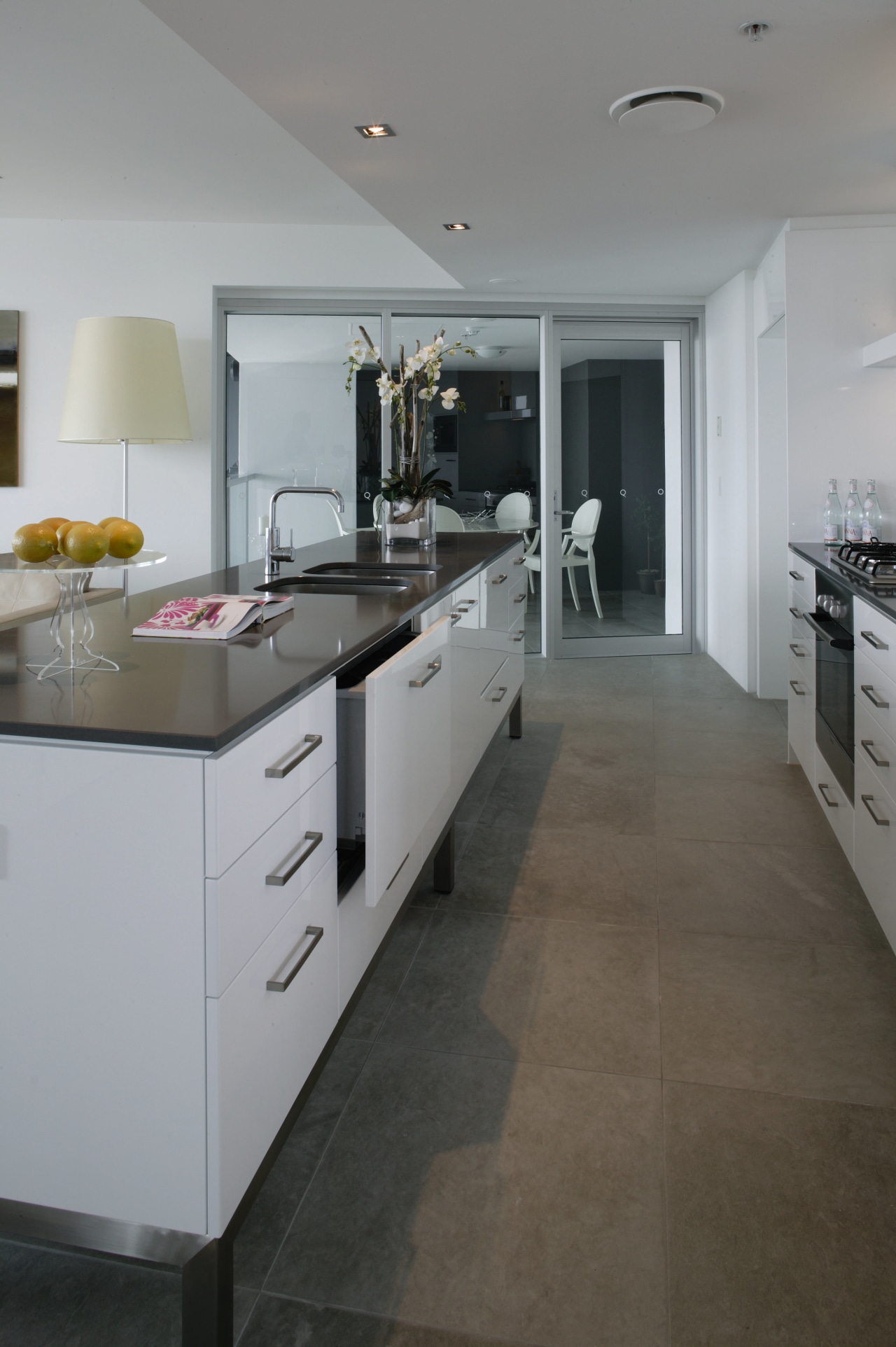 Kitchen with white cabinetry and black benchtop, and cabinetry, countertop, cuisine classique, floor, flooring, interior design, kitchen, room, tile, wood flooring, gray