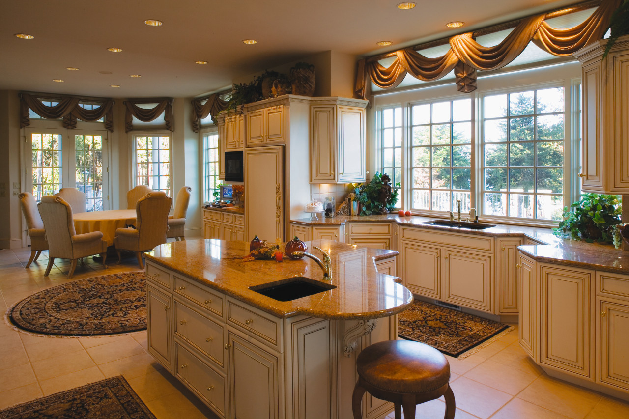 Open plan traditional style kitchen with cream cabinetry, cabinetry, countertop, cuisine classique, interior design, kitchen, real estate, room, window, brown