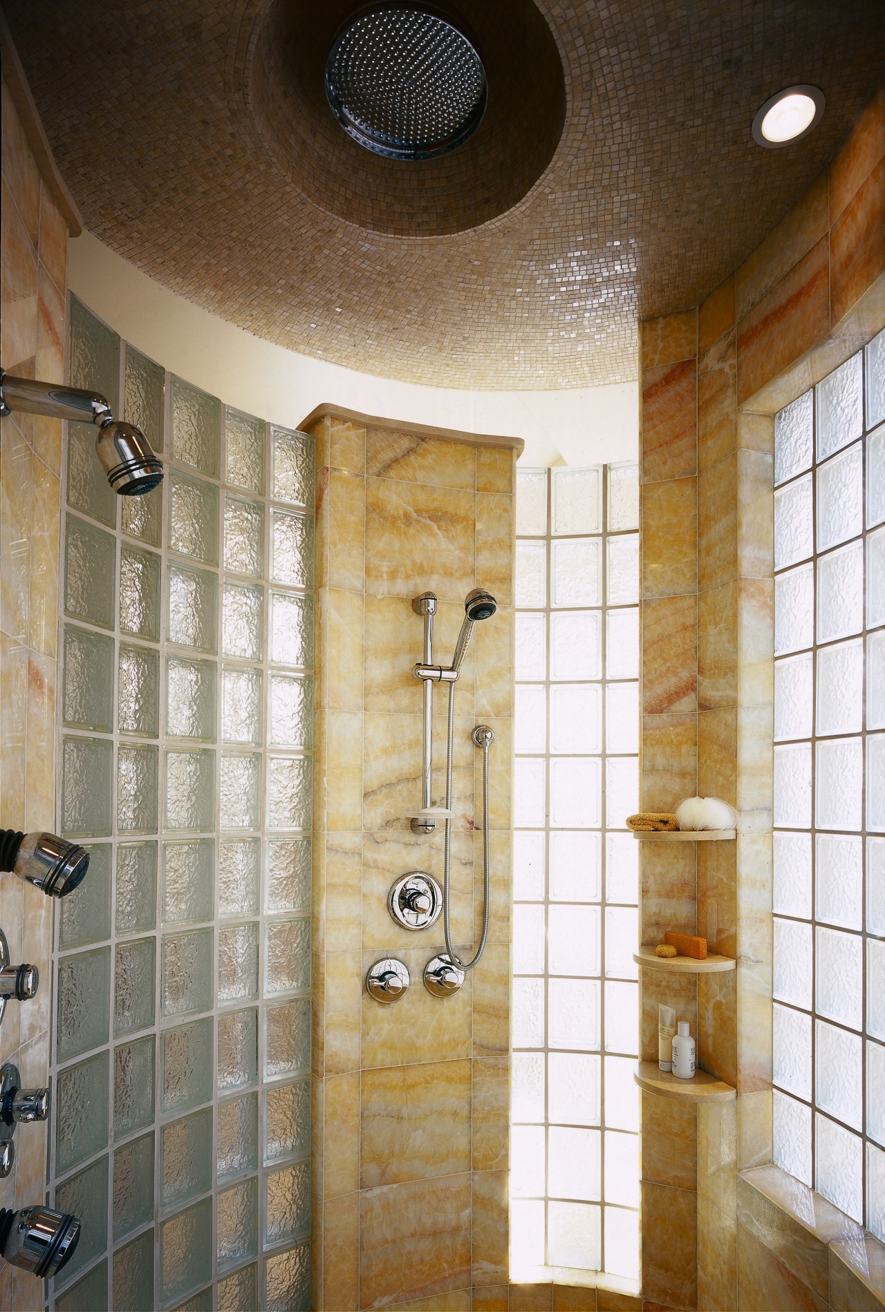 A view of the shower, glass tiled walls, bathroom, ceiling, floor, flooring, interior design, plumbing fixture, room, tile, wall, brown, gray