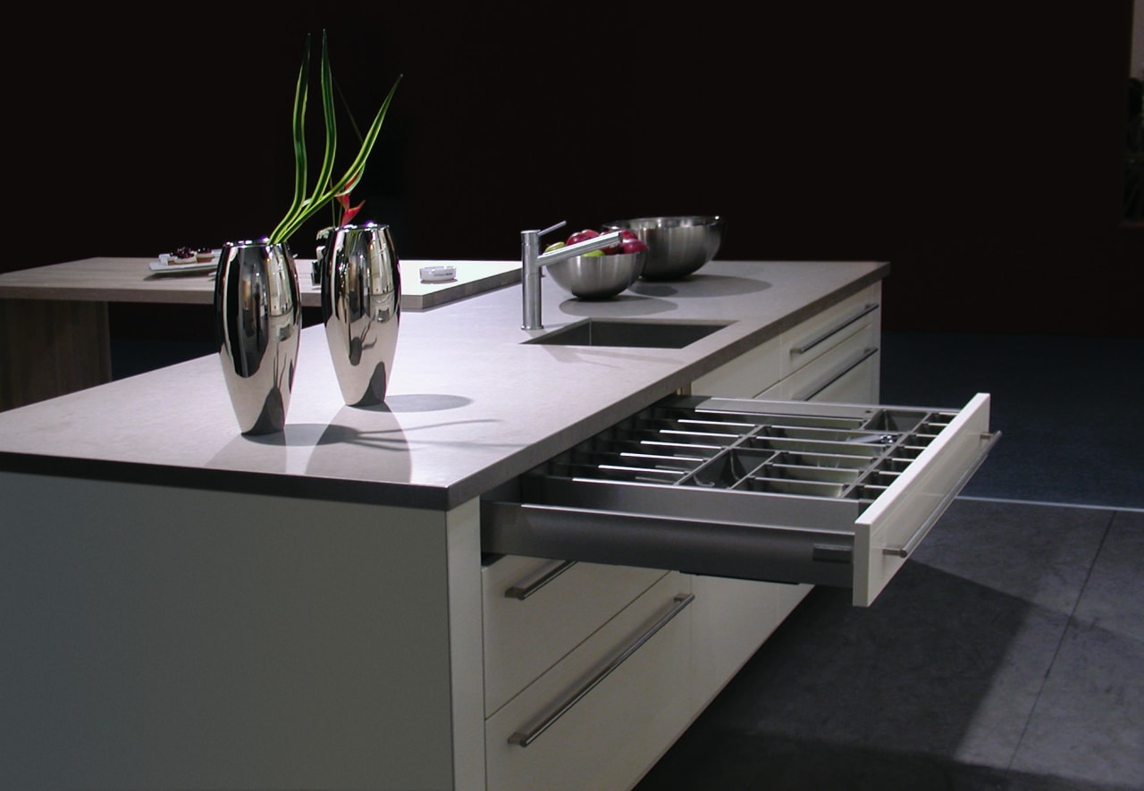 White and grey kitchen with large drawers and countertop, furniture, product design, table, black