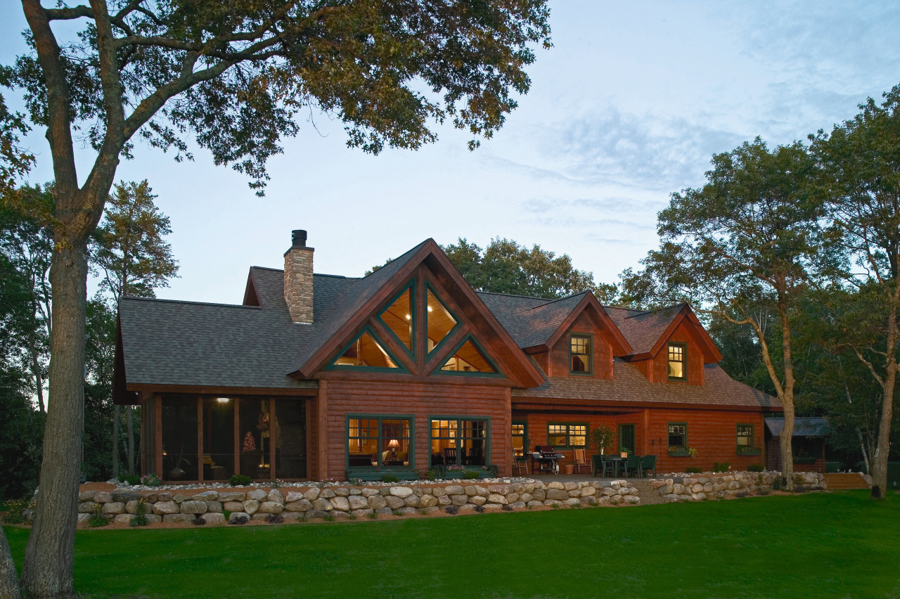 Exterior view of rustic style home. cottage, estate, facade, farmhouse, home, house, log cabin, mansion, property, real estate, roof, tree, brown