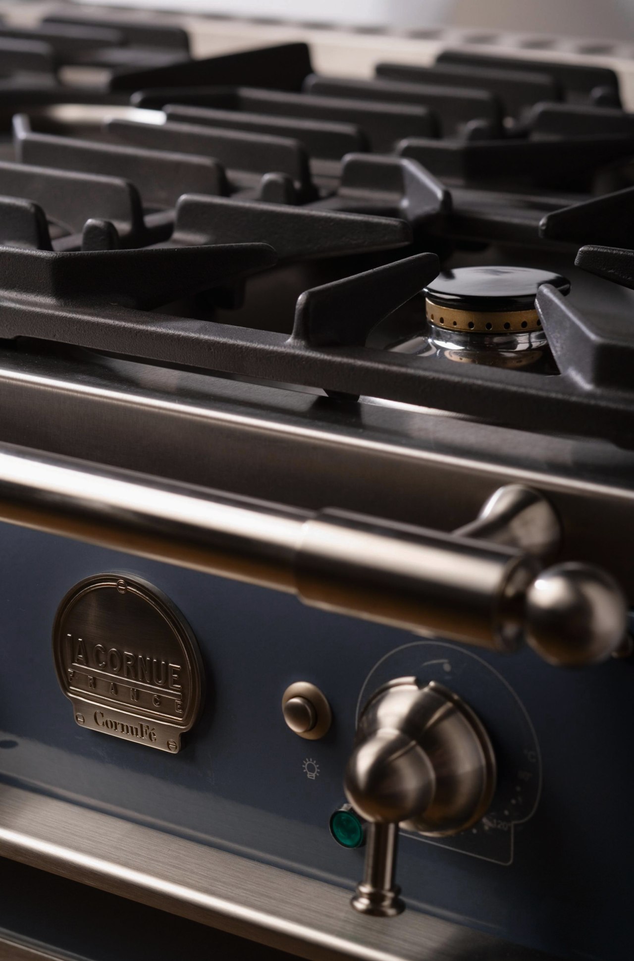 Closeup view of cooktop and control handles for black