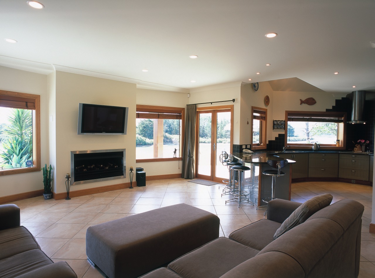 Open plan kitchen and lounge area with cream ceiling, floor, flooring, home, interior design, living room, property, real estate, room, window, gray