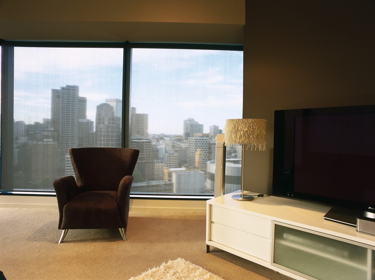 view of the helioscreen blinds in this apartment furniture, interior design, living room, property, real estate, table, window, brown