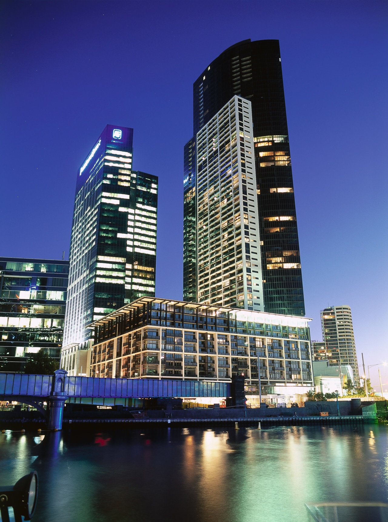 view of the freshwater place blends residential, comercial architecture, building, city, cityscape, commercial building, condominium, corporate headquarters, daytime, downtown, evening, headquarters, hotel, landmark, metropolis, metropolitan area, mixed use, night, reflection, residential area, sky, skyline, skyscraper, tower, tower block, urban area, water, blue