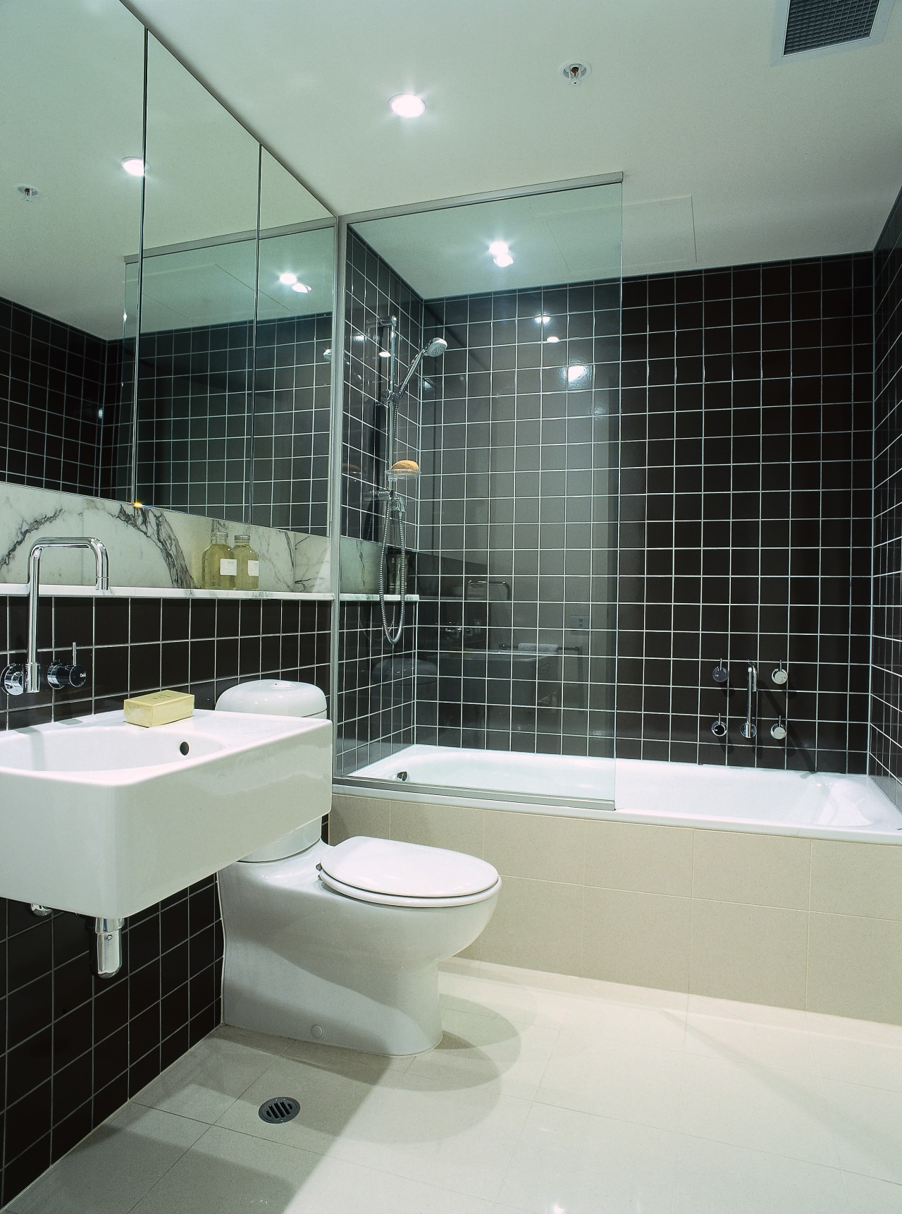 A view of some stone surfaces by SMG architecture, bathroom, floor, glass, interior design, property, room, tile, wall, gray, black