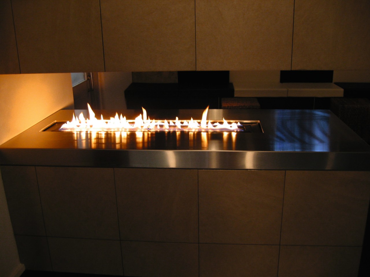 Gas burner fireplace feature. fireplace, hearth, heat, light, lighting, table, brown, black