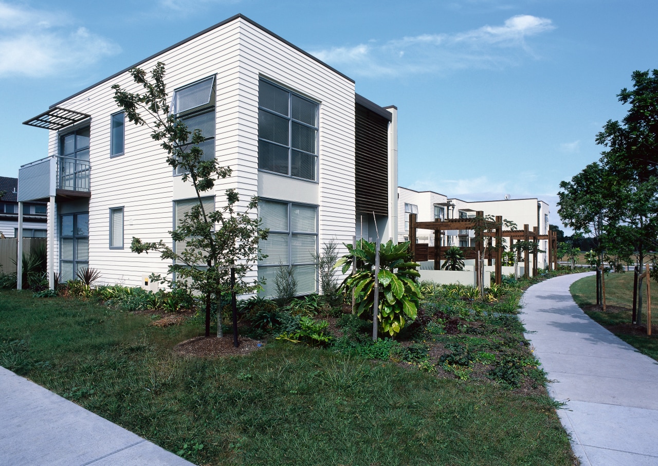 View of white two storey home with grass apartment, architecture, building, condominium, corporate headquarters, cottage, estate, facade, home, house, mixed use, neighbourhood, property, real estate, residential area, suburb, teal