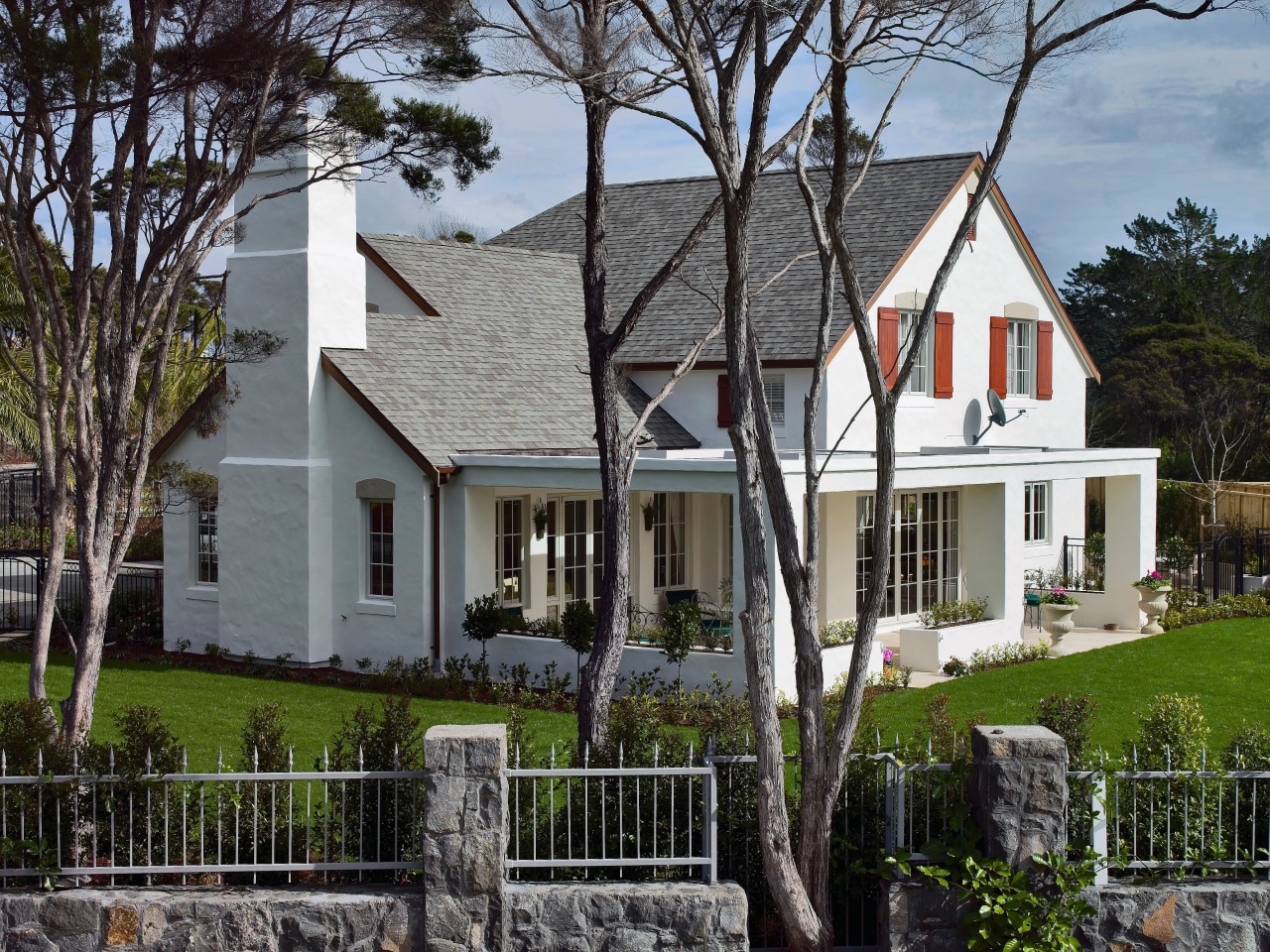 Large cream coloured masonry home with steep shingle building, cottage, estate, facade, farmhouse, historic house, home, house, mansion, neighbourhood, property, real estate, residential area, roof, tree, window, gray, black