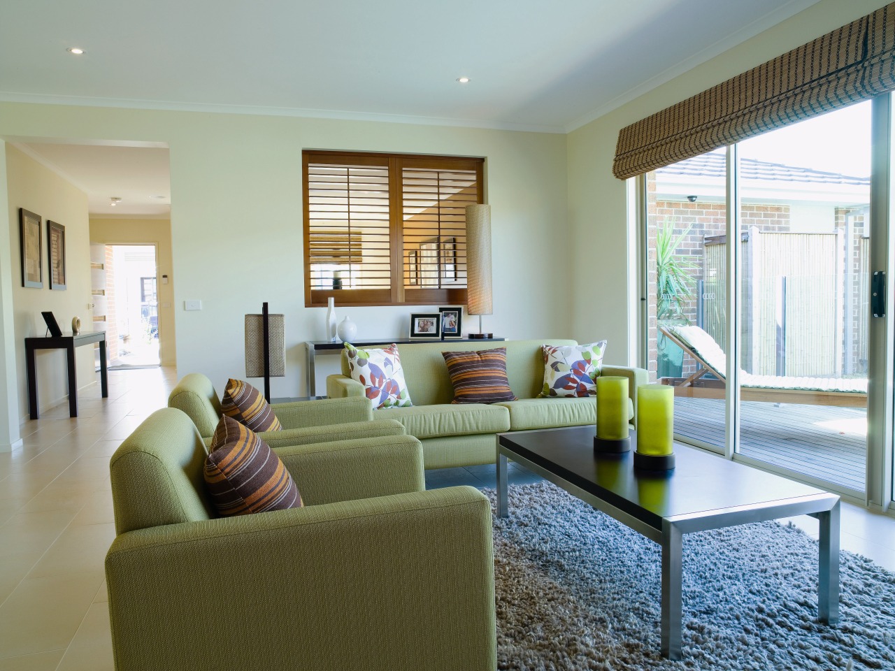 Lounge room with green sofas and chairs, stainless apartment, estate, home, house, interior design, living room, property, real estate, room, window, gray