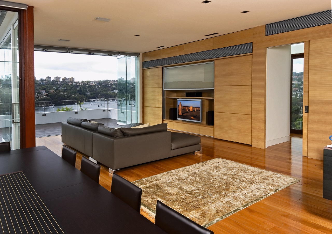 Family room with dark dining table, grey sofas floor, flooring, hardwood, interior design, living room, real estate, wood, wood flooring, brown