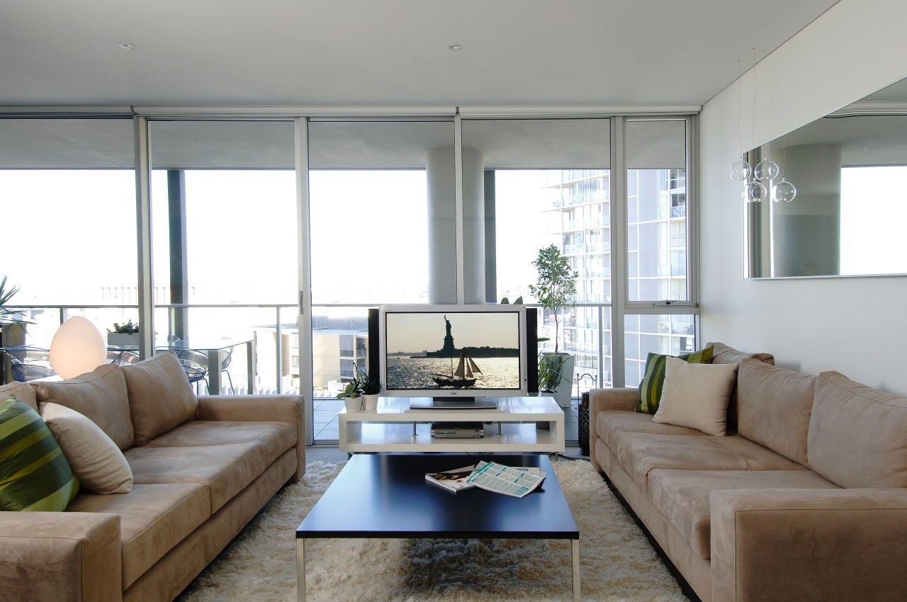 Lounge room with caramel coloured sofas, coffee table home, house, interior design, living room, property, real estate, room, window, gray, white