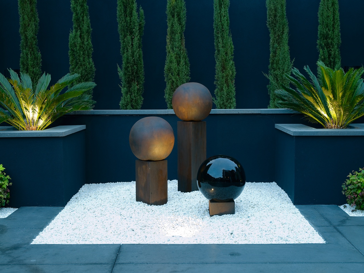 view of the ball sculptures sitting on the flowerpot, grass, lighting, majorelle blue, plant, blue