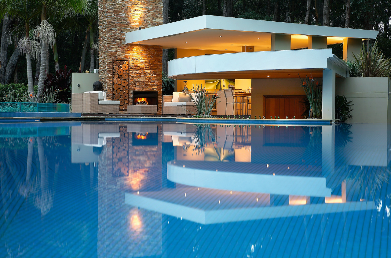 A viewof the pool and pation area, outdoor estate, home, house, leisure, lighting, property, real estate, reflection, resort, swimming pool, villa, water, teal