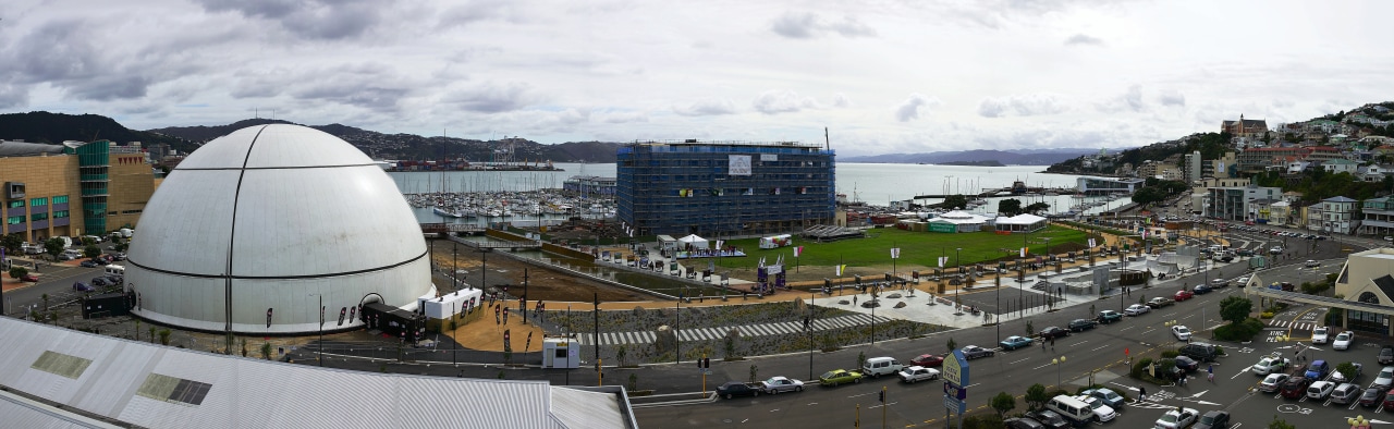 View of Wellington waterfront's Waitangi Park, with large city, white, black