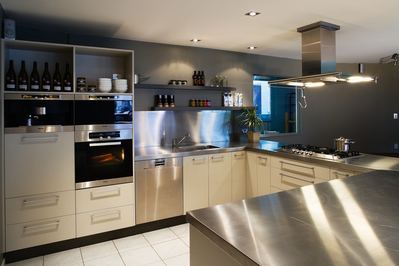 A view of a kitchen will stainless steel cabinetry, countertop, cuisine classique, interior design, kitchen, room, gray, black