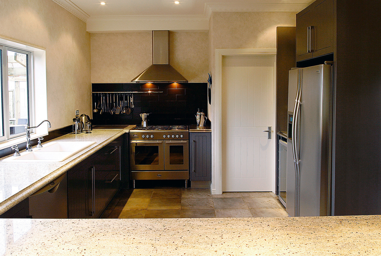 A view of a kitchen designed by Pauline cabinetry, countertop, cuisine classique, floor, flooring, home appliance, interior design, kitchen, real estate, room, brown, white