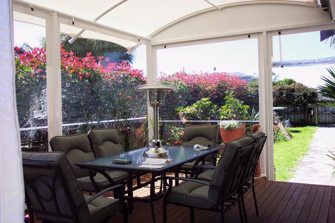 A view of a shade from Fresco Shades. backyard, house, outdoor structure, patio, plant, property, real estate, white, black