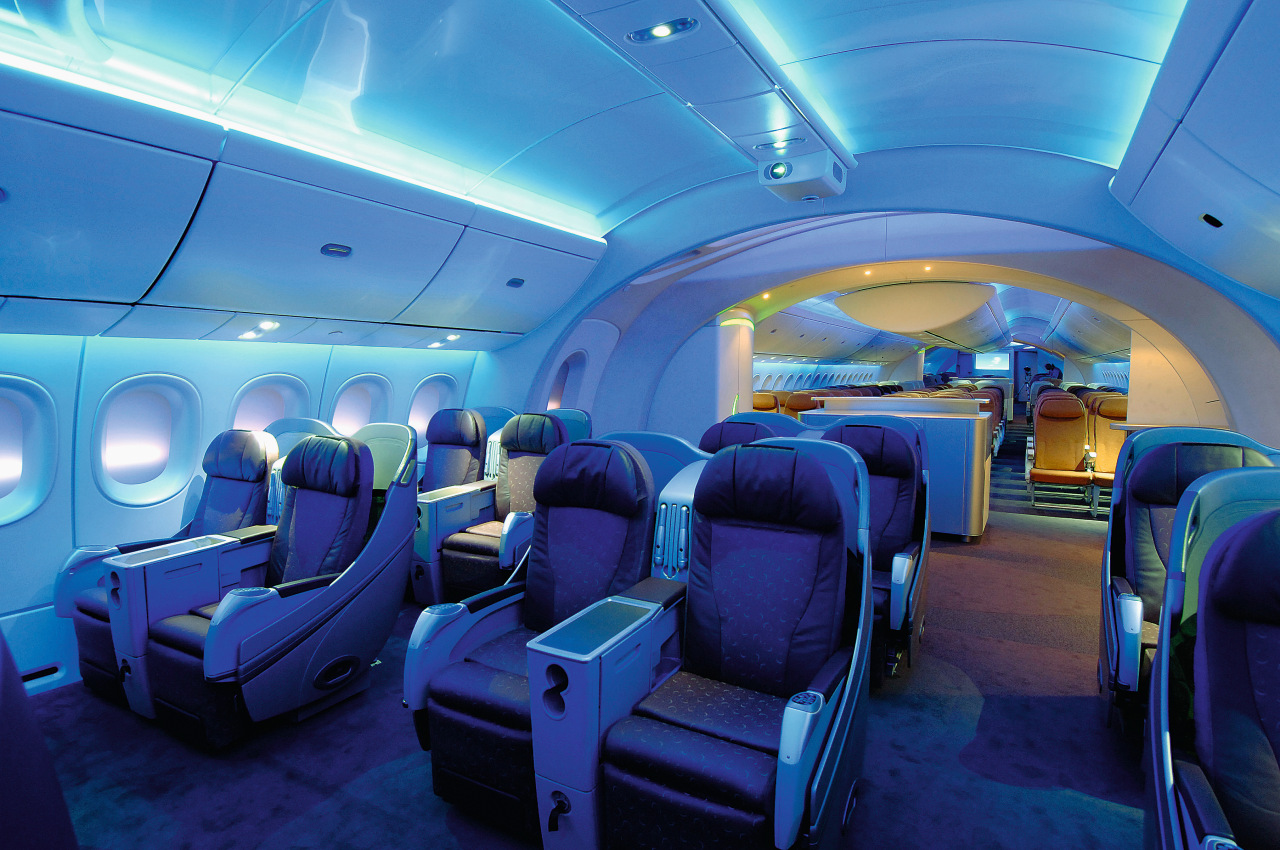 A view of the cabin area. aerospace engineering, air travel, aircraft, aircraft cabin, airline, airplane, aviation, blue, interior design, mode of transport, passenger, blue, teal