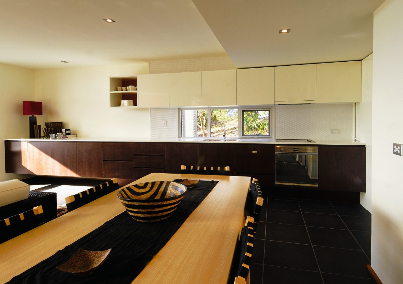 Apartment dining and kitchen area with long kitchen apartment, countertop, floor, flooring, interior design, kitchen, property, real estate, room, black, orange