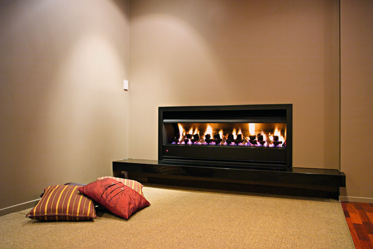 A view of a fireplace from Real Fires. fireplace, hearth, heat, interior design, wood burning stove, brown, orange