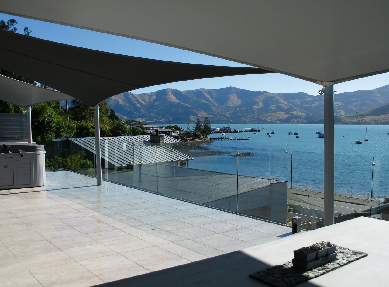 A view of a sail umbrella by Weather architecture, condominium, daylighting, glass, house, property, real estate, shade, swimming pool, window, gray, black