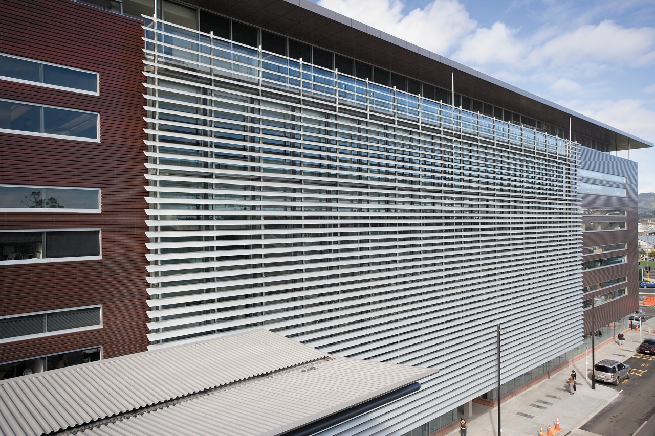 A view of the louvres. architecture, building, commercial building, corporate headquarters, daylighting, facade, headquarters, house, line, metropolitan area, real estate, residential area, roof, siding, structure, window, window covering, gray, black, white