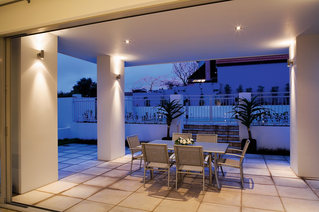 A view of a patio area concreted by apartment, ceiling, estate, home, house, interior design, lighting, property, real estate, wall, window, blue