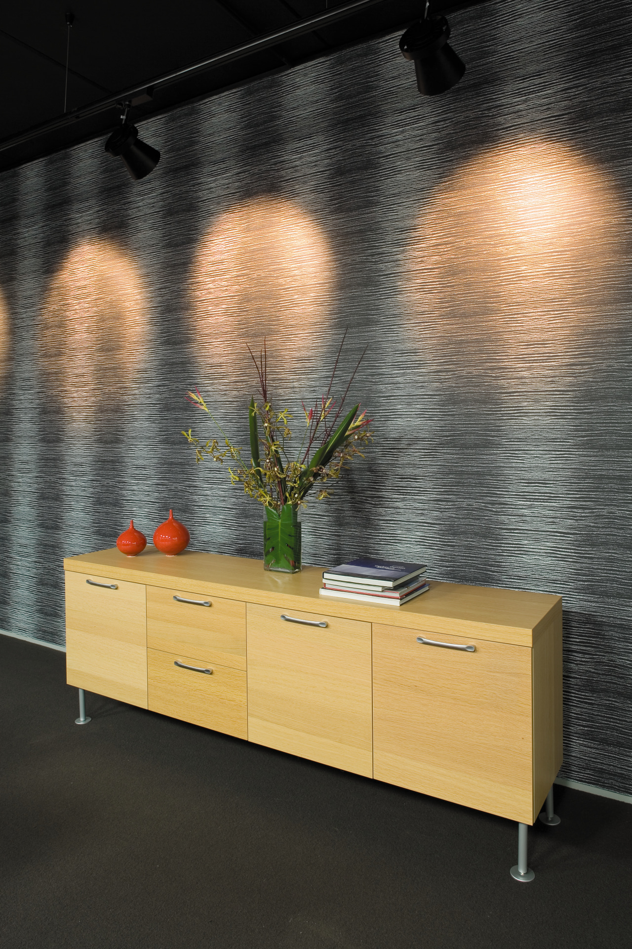 A view of some lighting. floor, flooring, furniture, interior design, product design, shelf, table, wall, black