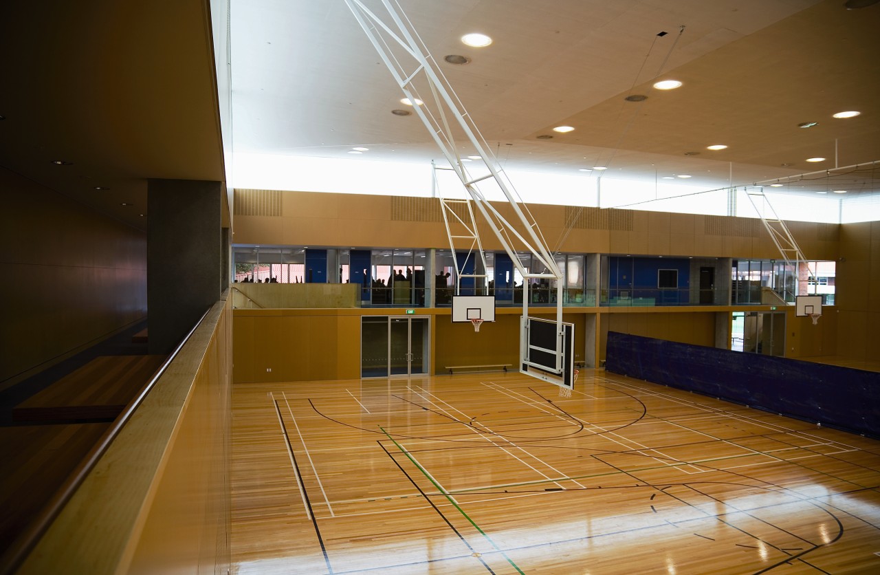 A view of the gymnasium. architecture, ceiling, daylighting, floor, flooring, interior design, leisure centre, lobby, sport venue, structure, wood, brown