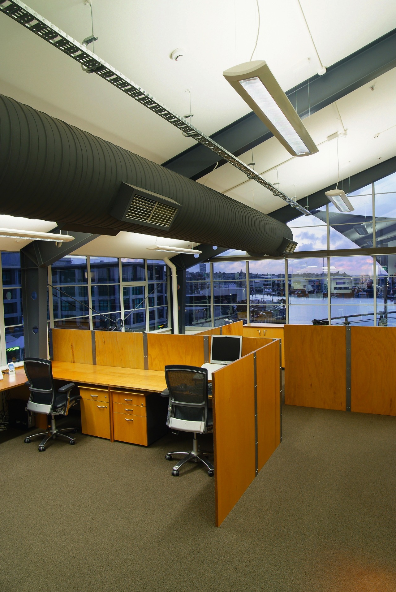 A view of an office by Hawkins Interiors. architecture, ceiling, daylighting, institution, interior design, office, brown