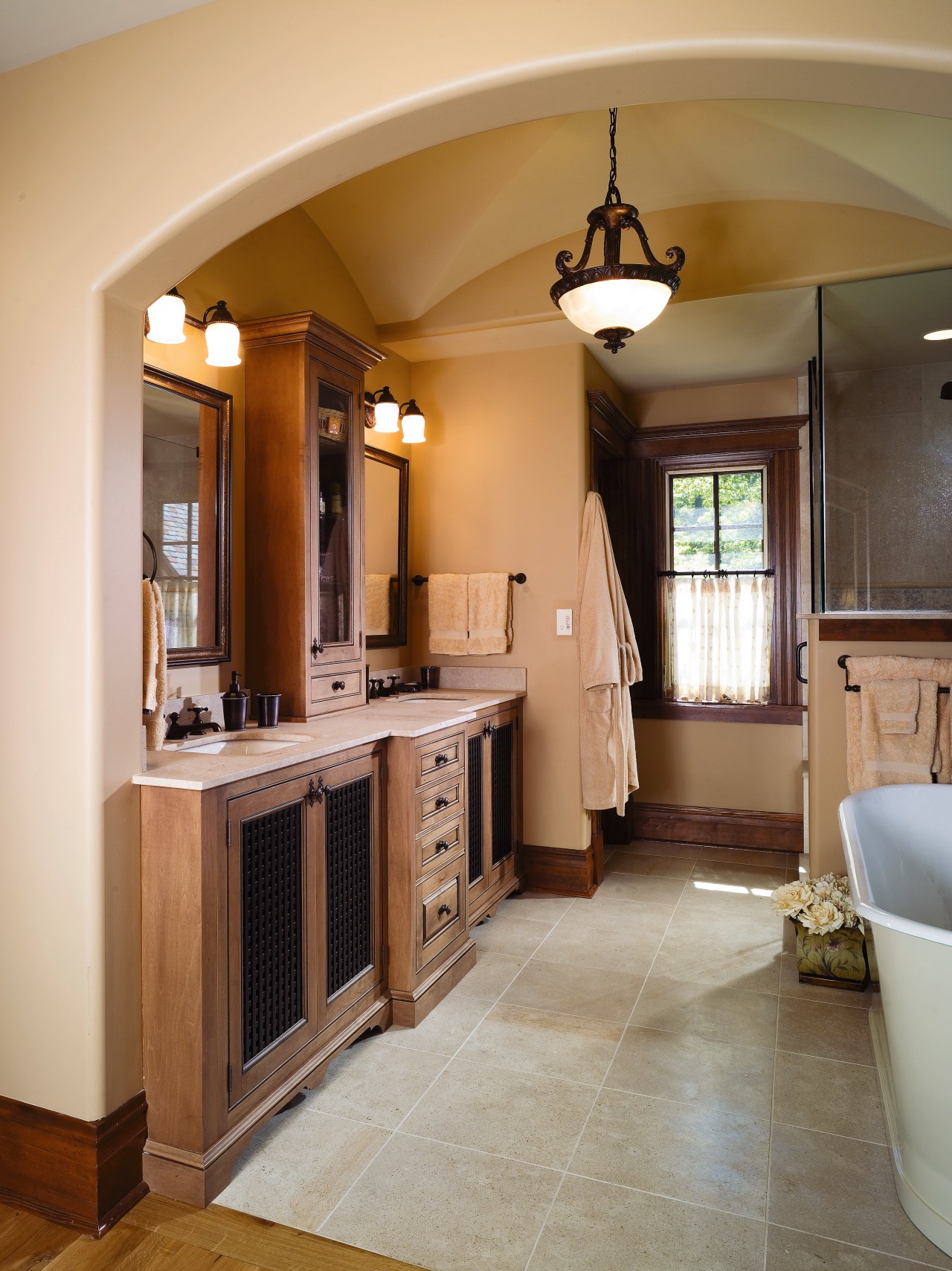 A view of a bathroom, tiled floor. cream bathroom, cabinetry, ceiling, countertop, floor, flooring, home, interior design, kitchen, room, brown, gray