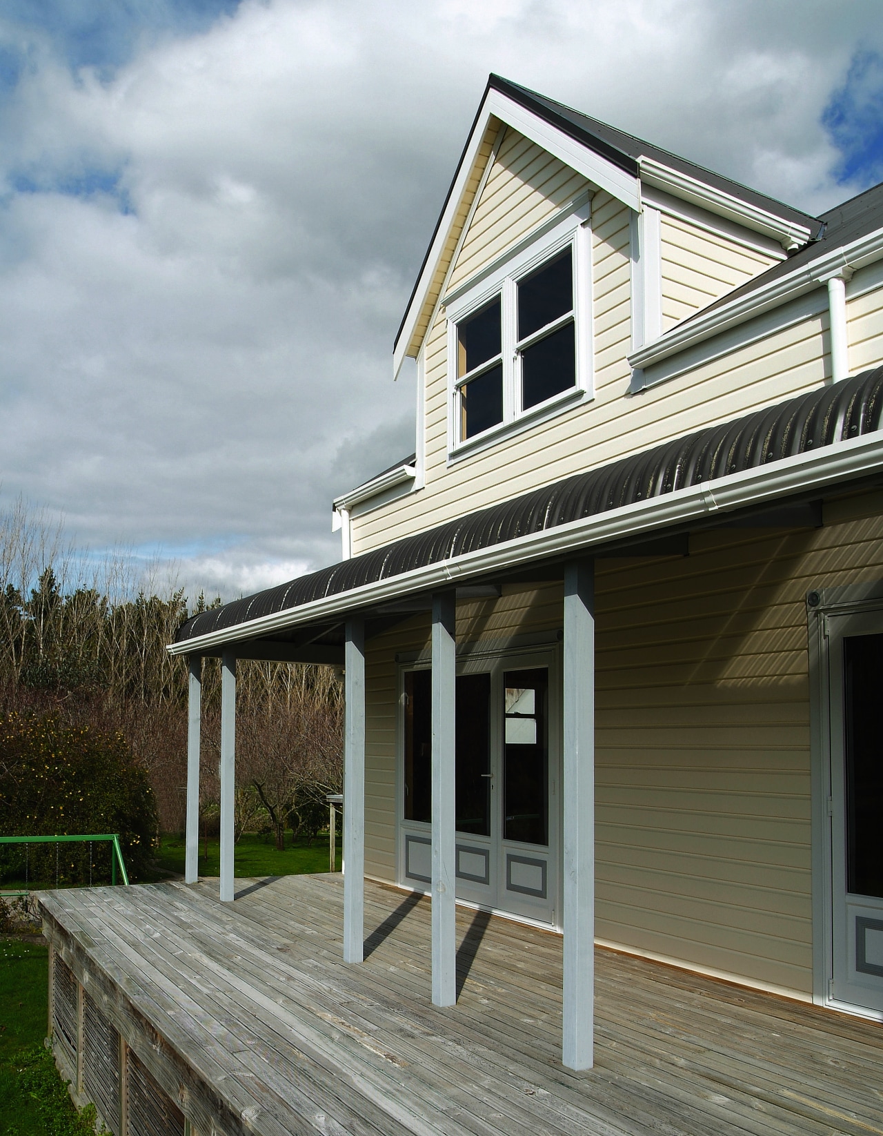 Exterior view of a home which features Palliside cottage, facade, farmhouse, home, house, porch, property, real estate, residential area, roof, siding, window, gray, black